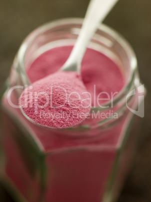 Spoon of Sel Rose on a Glass Jar