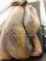 Whole Guinea Fowl on a Chopping Board