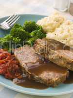 Mama's Meatloaf with Mashed Potato Broccoli Tomatoes and Gravy