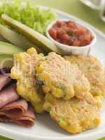 Sweet corn Fritters with Salsa Gherkins Avocado and Pastrami