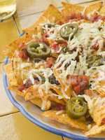 Platter of Nachos with Salsa Jalapenos and Cheese