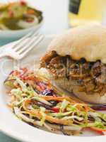 Pulled Pork and Barbeque Sauce Roll with Seeded Slaw and Gherkin