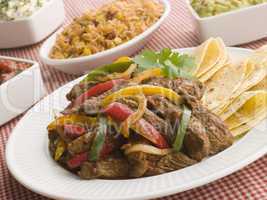 Steak Fajitas with Jambalaya Guacamole Salsa and Sour Cream