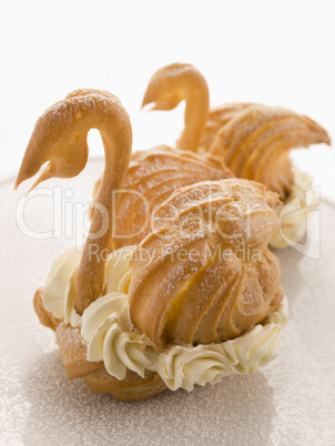 Two Choux Swans filled with Chantilly Cream