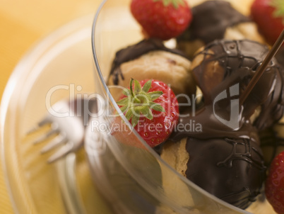 Chocolate Profiteroles with Strawberries and Chocolate Sauce
