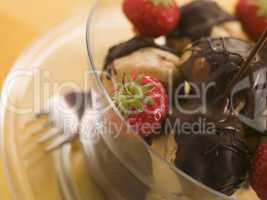 Chocolate Profiteroles with Strawberries and Chocolate Sauce