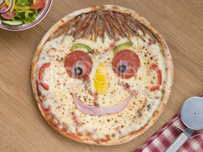 Smiley Faced Pizza with a Side Salad