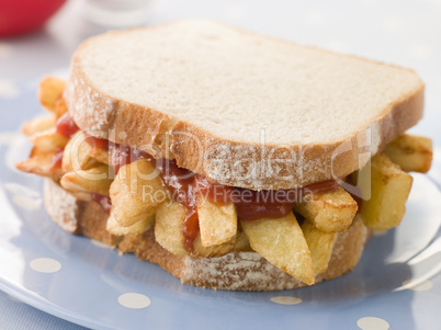 Chip Sandwich on White Bread with Tomato Ketchup