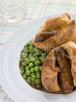 Individual Toad in the Holes with Gravy and Peas