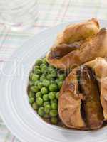 Individual Toad in the Holes with Gravy and Peas