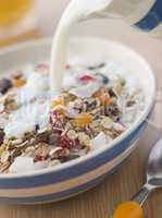 Pouring Milk over a Bowl of Museli