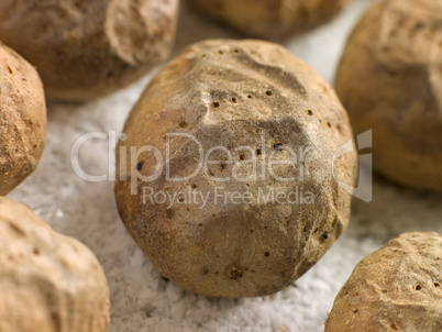 Jacket Potatoes baked on a tray of Sea Salt