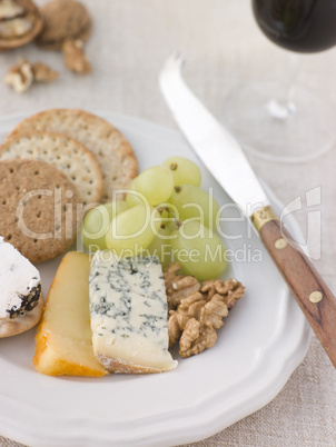Plate of Cheese and Biscuits with a Glass of Port