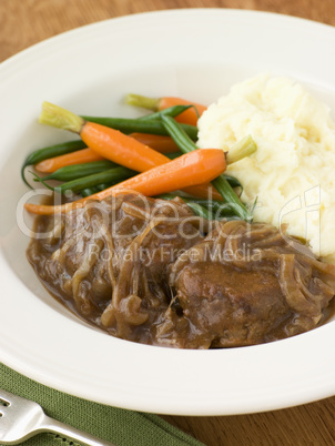 Faggots in Onion Gravy with Mashed Potato and Vegetables