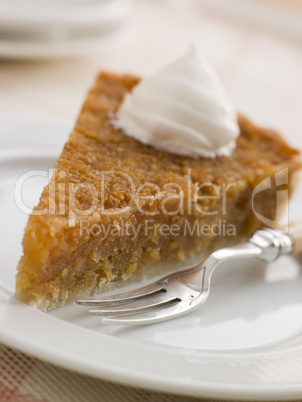 Slice of Treacle Tart with Whipped Cream