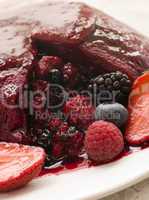 Traditional Summer Pudding with a scoop out