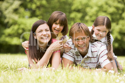 Family outdoors smiling