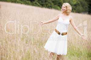 Woman standing outdoors smiling