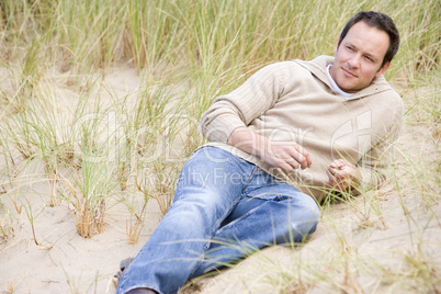 Man sitting back on beach