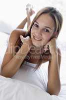 Woman lying in bed smiling