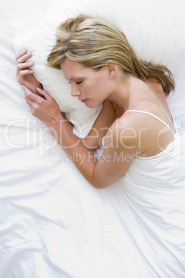 Woman lying in bed sleeping