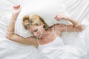 Woman lying in bed sleeping