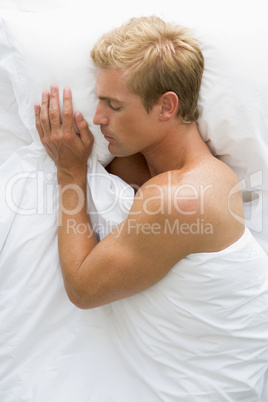 Man lying in bed sleeping