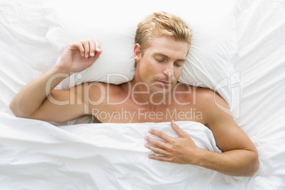 Man lying in bed sleeping