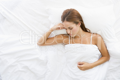 Woman lying in bed sleeping