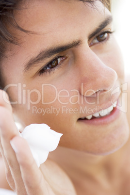 Man putting on shaving cream smiling