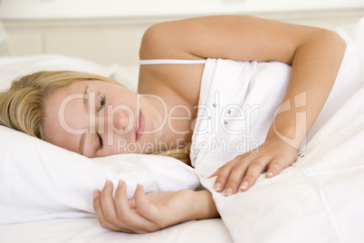 Woman lying in bed sleeping