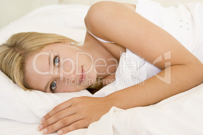 Woman lying in bed