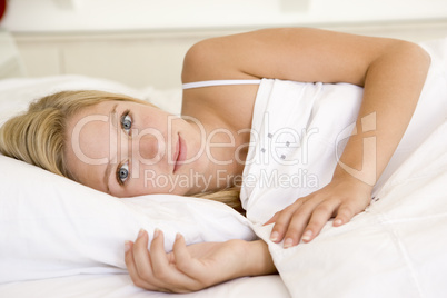 Woman lying in bed