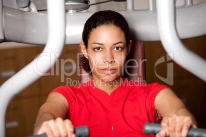 Beautiful girl on fitness machine