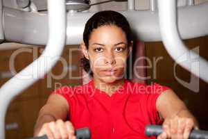 Beautiful girl on fitness machine