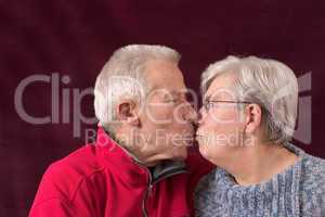 Kissing older couple