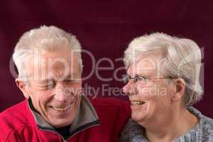 Laughing senior couple