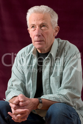 Senior man sitting in relaxed pose