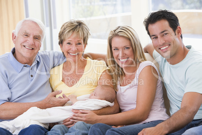 Family in living room with baby smiling