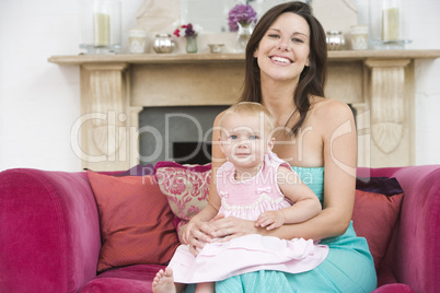 Mother in living room with baby smiling