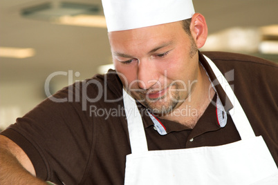 Italian chef working concentrated