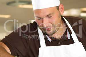 Italian chef working concentrated