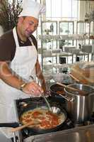 Italian chef cooking pasta