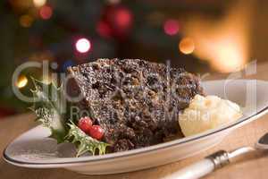 Portion of Christmas Pudding with Brandy Butter