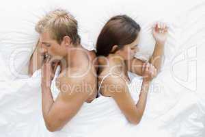 Couple in bed asleep