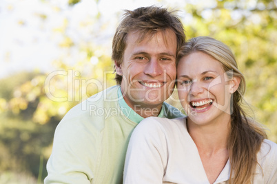 Couple outdoors smiling