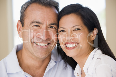 Couple in living room smiling