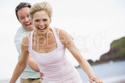 Couple at the beach smiling