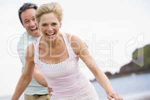 Couple at the beach smiling