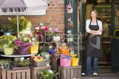 Woman working at flower shop smiling